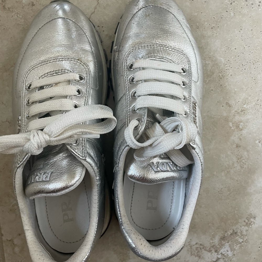 Lightly warn Prada sneakers with minor scratches